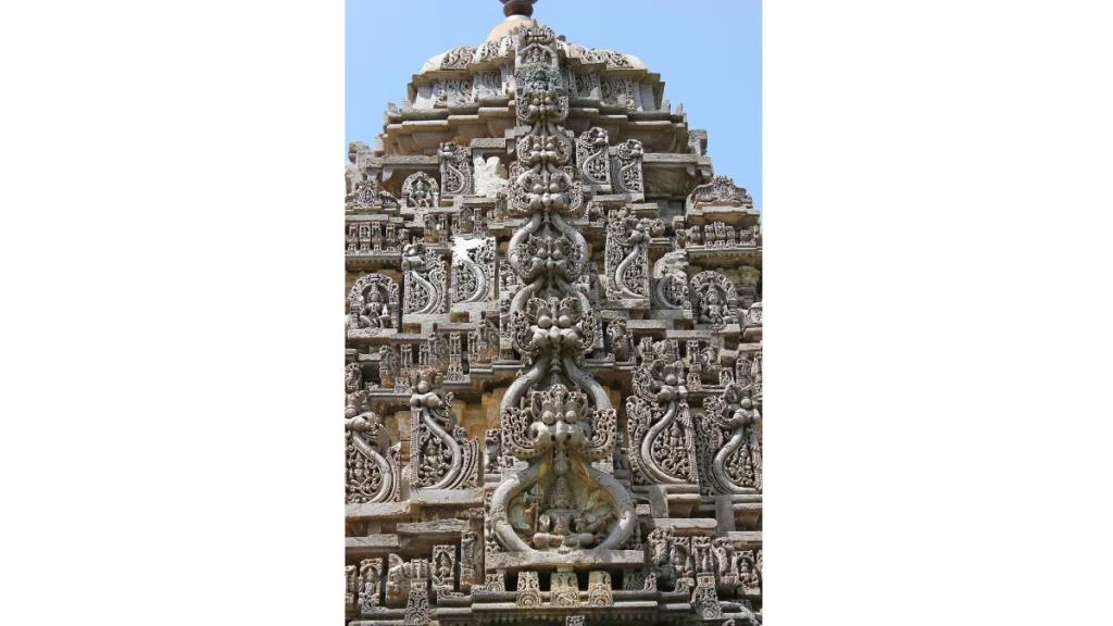 Kirtimukha sculptures on shikhara at Amrutesvara Temple